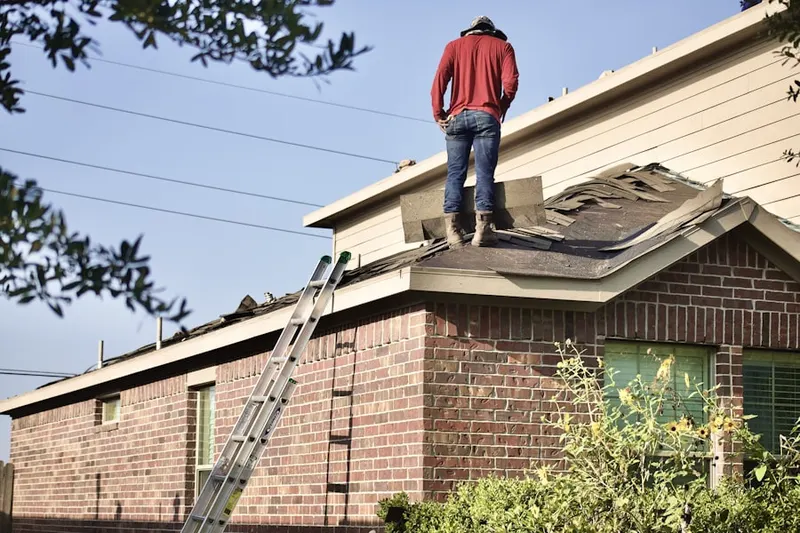 Professional roofer working on a residential roof in Gaithersburg